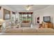 Living room featuring neutral colored sofas and view to backyard at 5648 Sunset Falls Dr, Apollo Beach, FL 33572