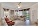 Living room with light walls, tile floors, and backyard view at 5648 Sunset Falls Dr, Apollo Beach, FL 33572