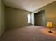 Bedroom with closet, neutral walls, carpet, and window at 7140 Orchid Lake Rd, New Port Richey, FL 34653