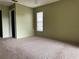 Bedroom with neutral walls, carpet, closet and natural light at 7140 Orchid Lake Rd, New Port Richey, FL 34653
