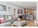 Open living room with a view of the kitchen and breakfast bar at 30552 Latourette Dr, Wesley Chapel, FL 33545