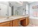 Bathroom with double sinks, a soaking tub, and a separate shower at 30552 Latourette Dr, Wesley Chapel, FL 33545
