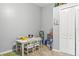 playroom with a table, chairs, and plenty of toys at 30552 Latourette Dr, Wesley Chapel, FL 33545