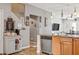 Kitchen with light wood cabinets, stainless steel appliances, and an island with seating at 30552 Latourette Dr, Wesley Chapel, FL 33545