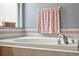 Bathroom with garden tub, and a shower at 30552 Latourette Dr, Wesley Chapel, FL 33545