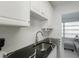 Modern kitchen with stainless steel appliances and dark countertops at 2960 59Th S St # 509, Gulfport, FL 33707