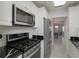 Updated kitchen featuring stainless steel appliances and white cabinets at 2960 59Th S St # 509, Gulfport, FL 33707