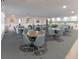 Bright community room with multiple tables and chairs, perfect for gatherings at 2960 59Th S St # 509, Gulfport, FL 33707
