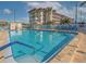 Sparkling community pool, surrounded by lounge chairs at 2960 59Th S St # 509, Gulfport, FL 33707