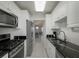 Open kitchen boasting stainless steel appliances and granite countertops at 2960 59Th S St # 509, Gulfport, FL 33707