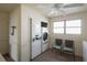 Clean laundry room with multiple machines and seating at 2960 59Th S St # 509, Gulfport, FL 33707