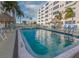 Inviting community pool with surrounding patio furniture at 2960 59Th S St # 509, Gulfport, FL 33707