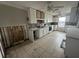 Kitchen with white cabinets and granite countertops, under renovation at 620 Dalton Blvd, Port Charlotte, FL 33952