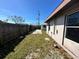 Spacious backyard with a wooden fence and shed at 620 Dalton Blvd, Port Charlotte, FL 33952