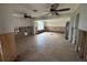 Large living room with ceiling fans and tiled floors, currently under renovation at 620 Dalton Blvd, Port Charlotte, FL 33952