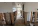 Hallway showing extensive water damage and exposed framing at 620 Dalton Blvd, Port Charlotte, FL 33952