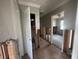 Hallway with water damaged walls, under renovation at 620 Dalton Blvd, Port Charlotte, FL 33952