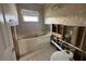 Unfinished bathroom with bathtub, toilet, and plumbing exposed at 620 Dalton Blvd, Port Charlotte, FL 33952