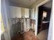 Unfinished laundry room with white cabinets and tile floor at 620 Dalton Blvd, Port Charlotte, FL 33952