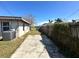 Property features a large backyard with a wooden deck and a concrete patio at 620 Dalton Blvd, Port Charlotte, FL 33952