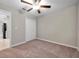 Spacious bedroom with ceiling fan and neutral carpeting at 12110 Miracle Mile Dr, Riverview, FL 33578