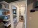 Bright hallway with built-in shelving and access to bedroom at 10263 Gandy N Blvd # 2114, St Petersburg, FL 33702
