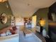 Bright living room featuring a cozy sofa and a view into the kitchen at 10263 Gandy N Blvd # 2114, St Petersburg, FL 33702