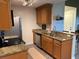 Updated kitchen with granite countertops and wood cabinets at 10263 Gandy N Blvd # 2114, St Petersburg, FL 33702