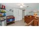 Well-lit Bedroom with a dresser, changing area, and animal themed decor at 15901 Manning Dr, Tampa, FL 33613