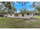 Back of house, showcasing exterior and yard at 15901 Manning Dr, Tampa, FL 33613