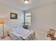 Simple bedroom with rocking chair and large window at 5648 Sunset Falls Dr, Apollo Beach, FL 33572