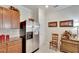 Kitchen boasts stainless steel refrigerator and ample wood cabinetry at 5648 Sunset Falls Dr, Apollo Beach, FL 33572