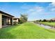 Community canal view with lush green grass at 5648 Sunset Falls Dr, Apollo Beach, FL 33572