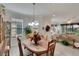 Charming dining area with a wood table and chandelier at 5648 Sunset Falls Dr, Apollo Beach, FL 33572