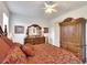 Spacious bedroom with a large bed, dresser, and built-in wooden wardrobe at 5648 Sunset Falls Dr, Apollo Beach, FL 33572