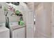 Laundry room features washer, dryer, and built-in shelving for storage at 5648 Sunset Falls Dr, Apollo Beach, FL 33572