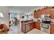 Spacious kitchen with stainless steel appliances and granite countertops at 5648 Sunset Falls Dr, Apollo Beach, FL 33572