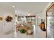 Open living room with a view of the dining area and access to the front door at 5648 Sunset Falls Dr, Apollo Beach, FL 33572