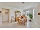 Spacious dining area with hardwood floors and large windows at 5648 Sunset Falls Dr, Apollo Beach, FL 33572