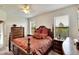 Comfortable bedroom with a king-size bed, wooden furniture, and large windows at 5648 Sunset Falls Dr, Apollo Beach, FL 33572