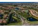 Aerial view of community, showcasing homes, lakes, and landscaping at 5648 Sunset Falls Dr, Apollo Beach, FL 33572
