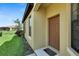 House exterior with a brown door, side windows, and a nicely landscaped area at 5648 Sunset Falls Dr, Apollo Beach, FL 33572