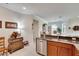 Bright kitchen with hardwood floors and a view into the dining area at 5648 Sunset Falls Dr, Apollo Beach, FL 33572