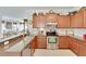 Modern kitchen featuring stainless steel appliances and granite countertops at 5648 Sunset Falls Dr, Apollo Beach, FL 33572
