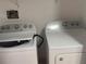 Bright laundry room with Whirlpool washer and dryer at 19111 Vista Bay Dr # 308, Indian Shores, FL 33785