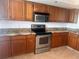 Kitchen with granite countertops and stainless steel appliances at 19111 Vista Bay Dr # 308, Indian Shores, FL 33785
