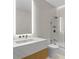 Contemporary bathroom with a sleek floating vanity and frameless glass shower enclosure at 1000 Water St # 1402, Tampa, FL 33602