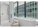 Spa-like bathroom with soaking tub and walk-in shower at 1000 Water St # 1402, Tampa, FL 33602