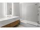Modern bathroom with a floating vanity, marble countertop, and a frameless glass shower at 1000 Water St # 1402, Tampa, FL 33602