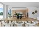 Elegant dining area with a large wooden table and city views at 1000 Water St # 1402, Tampa, FL 33602